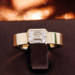 Emerald Cut Bezel Solitaire Ring in Yellow Gold with Wide Polished Band